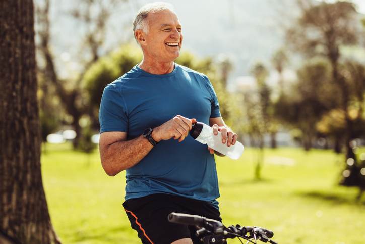 Senior fitness man drinking water