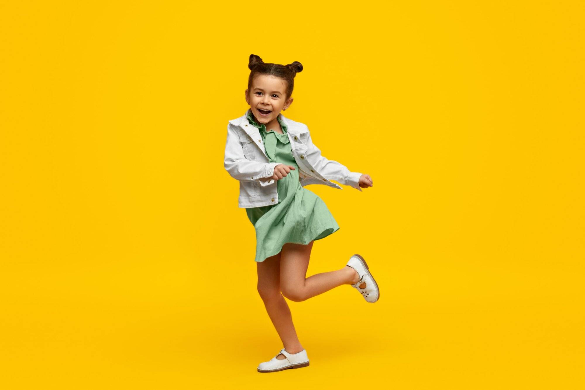 Stylish child smiling and dancing Discover This Austin Kids Store Where Imagination Meets Play